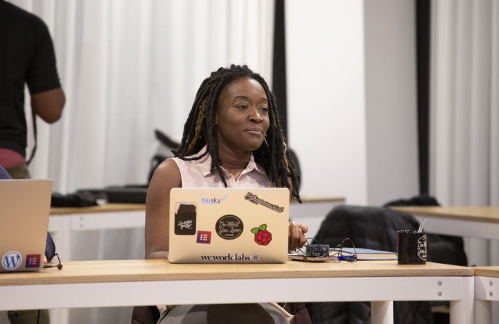 Tonisha_Sitting_And_Smiling_Infront_Of_Computer