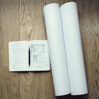 An Image Of An Architects Notebook And Blueprints An Image Of An Architects Notebook And Blueprints